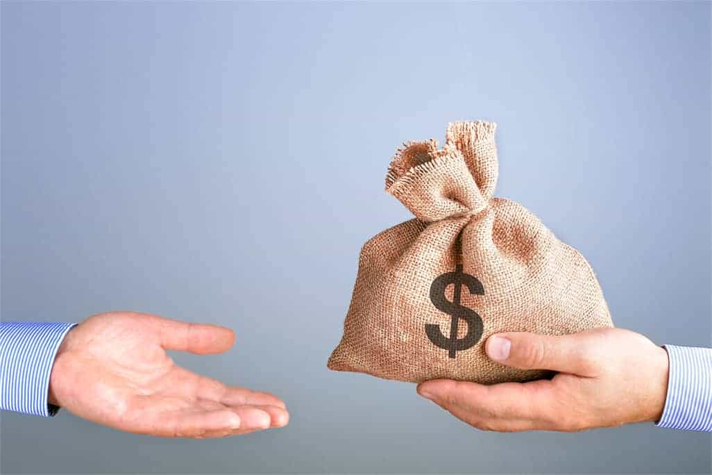 man holds gives bag money hand