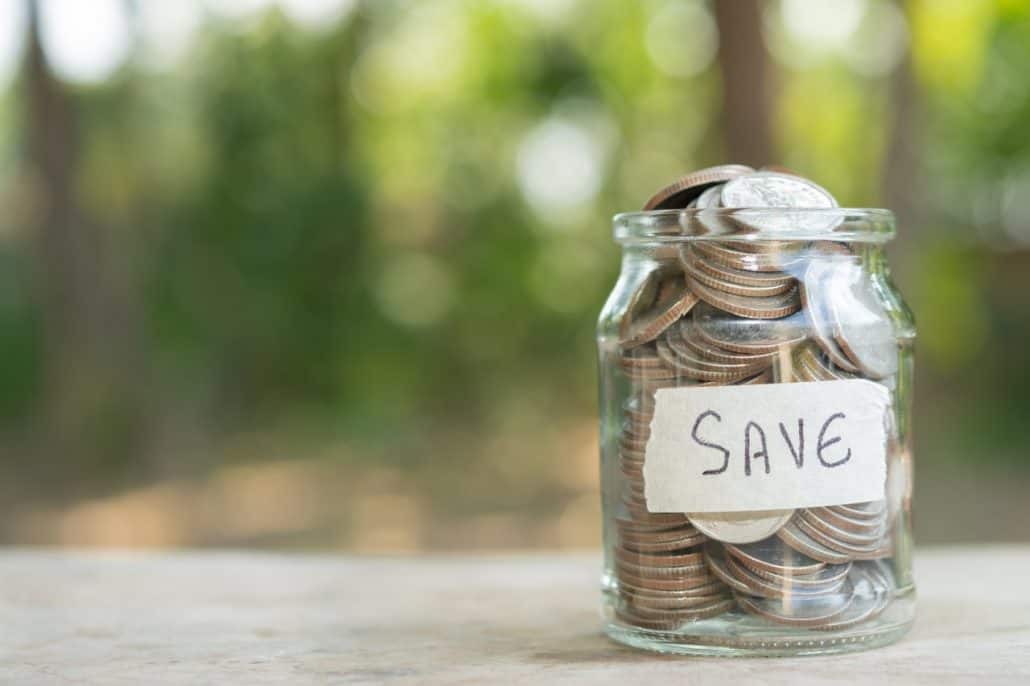 Coins in glass jar for money saving