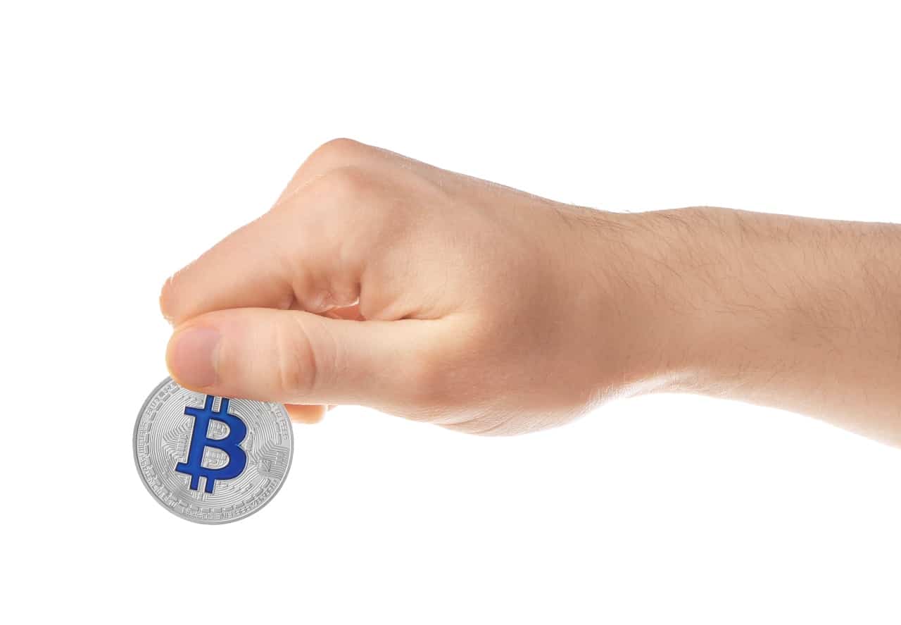 man holding bitcoin