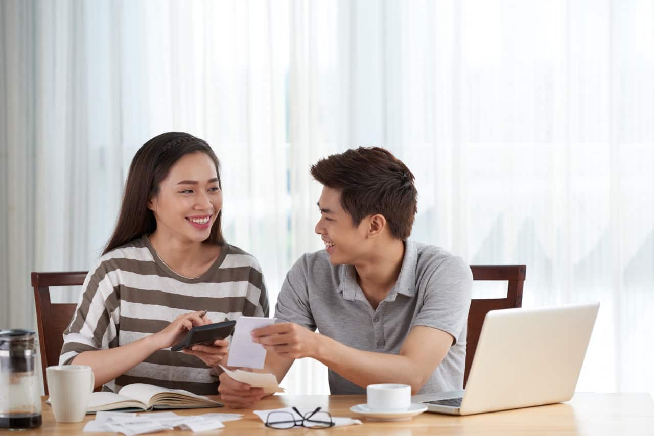 young couple managing family budget